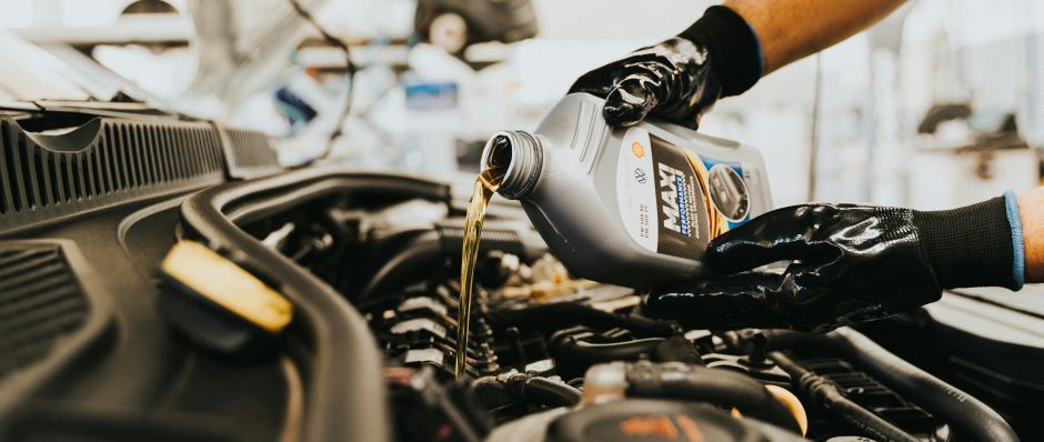 pouring oil onto engine